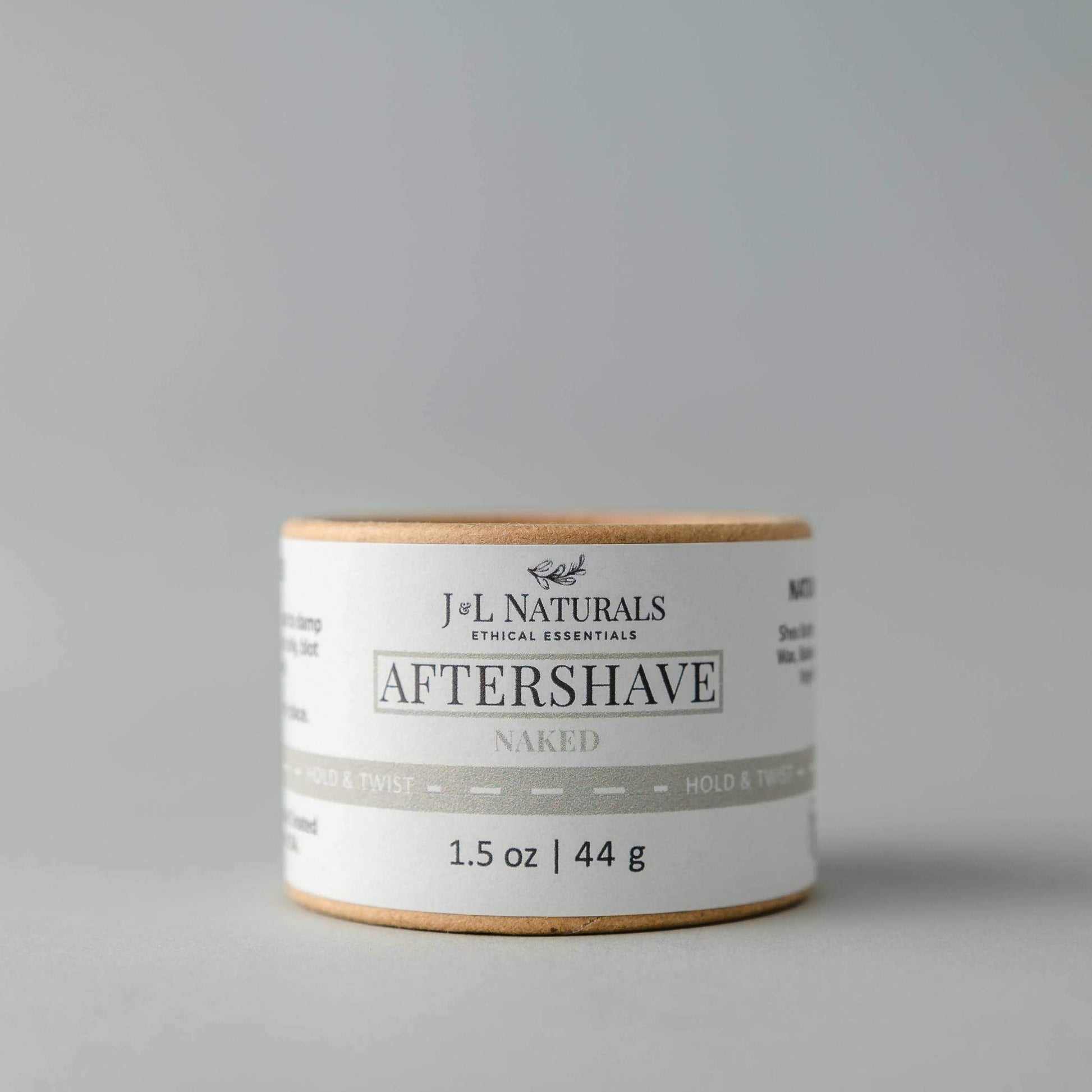 J&L Naturals aftershave product on a gray background