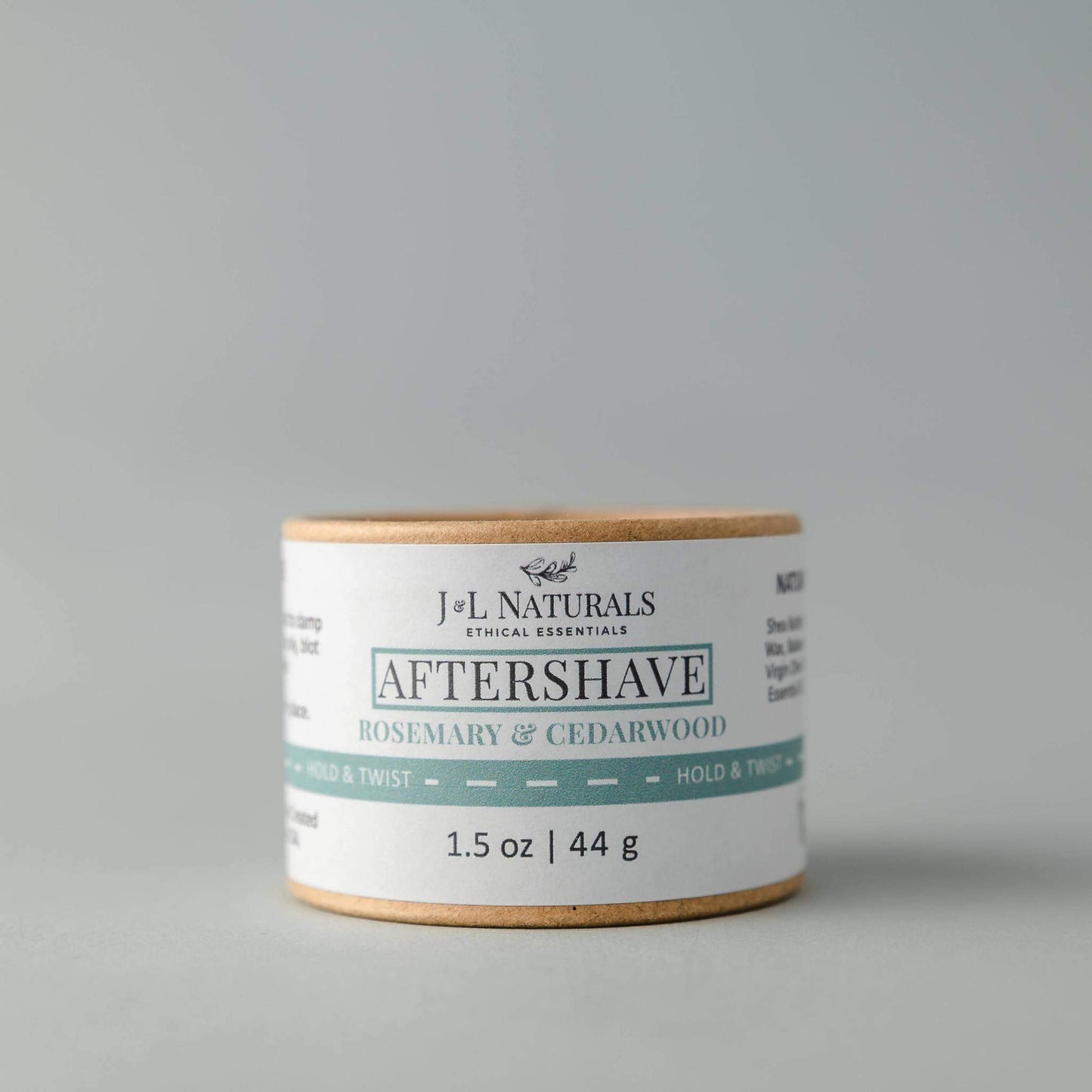 J&L Naturals aftershave product on a gray background