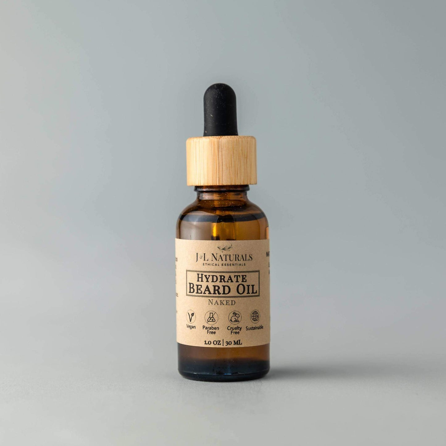 Bottle of hydrate beard oil with a dropper on a gray background